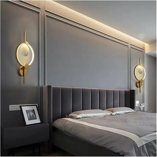 LIGHT HUB Set Yara & Omni modern gold circular wall sconces with marble accents mounted in a contemporary bedroom